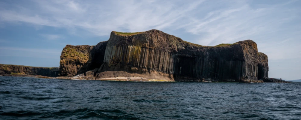 a rocky island on the water